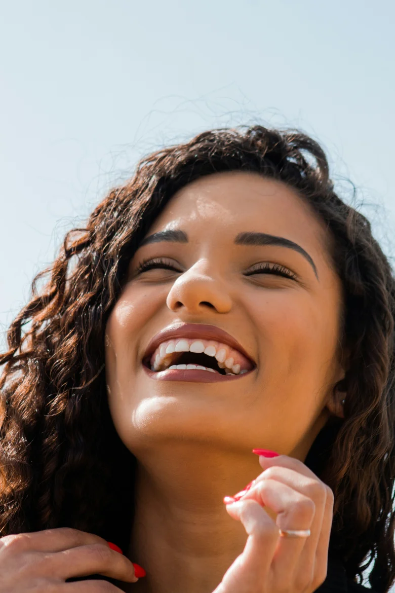 Woman with brown hair smiling
